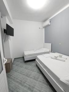 Postel nebo postele na pokoji v ubytování Joen Apartments