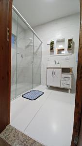 a bathroom with a shower and a sink at CASA DA ANA E ZÉ in Governador Celso Ramos +52 photos