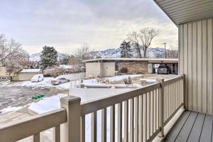 a balcony of a house with a snow covered yard at Millcreek Home with Mtn View Less Than 8 Mi to SLC! in Millcreek