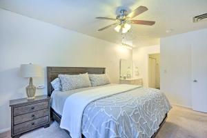 a bedroom with a bed and a ceiling fan at Millcreek Home with Mtn View Less Than 8 Mi to SLC! in Millcreek