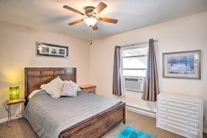 a bedroom with a bed and a ceiling fan at Quaint Montrose Cottage Less Than 1 Mi to Main Street in Montrose