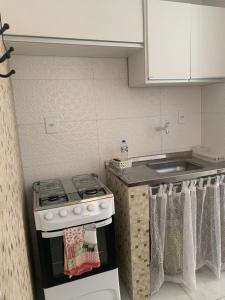 a kitchen with a stove and a sink at Residencial Morro de São Paulo in Morro de São Paulo +94 photos
