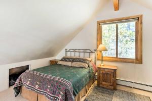 a bedroom with a bed and a window at Marble Hideaway Cabin with Mountain Views and Deck! in Marble +29 photos