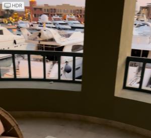 a balcony with a view of a marina with boats at MB13 Abu Tig Marina Apartment in Hurghada