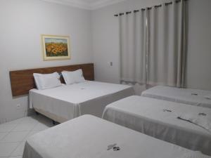 Postel nebo postele na pokoji v ubytování Hotel Master