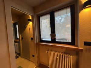 a room with a window and a radiator in a room at Fraiteve Suite in Sauze dʼOulx