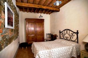 Postel nebo postele na pokoji v ubytování Agriturismo Podere Luisa