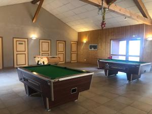 a large room with two pool tables in it at Studio - Le D2 du Grand Tetras in Samoëns