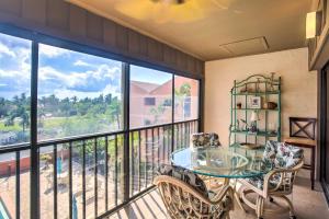 a dining room with a glass table and chairs on a balcony at Resort-Style Condo with Pool 19 Miles to Fort Myers in Burnt Store Marina