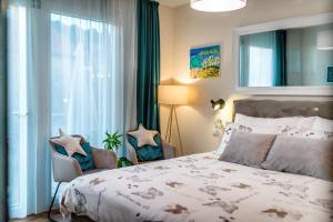 Posteľ alebo postele v izbe v ubytovaní Apartments Stella Mariela + 37 fotografií
