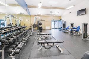 a gym with rows of treadmills and machines at Resort-like luxurious condo in Woodland Hills, Los Angeles, Pool, Hot-tub, and more in Woodland Hills