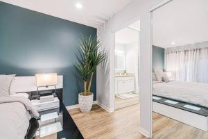 a bedroom with a mirror next to a bed and aarijuana at Resort-like luxurious condo in Woodland Hills, Los Angeles, Pool, Hot-tub, and more in Woodland Hills