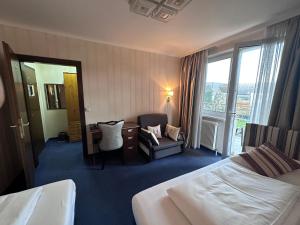 Postel nebo postele na pokoji v ubytování Hotel Austria