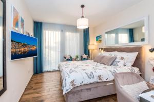 Posteľ alebo postele v izbe v ubytovaní Apartments Stella Mariela