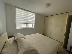 Кровать или кровати в номере Departamento Full La Serena +9 фотографий