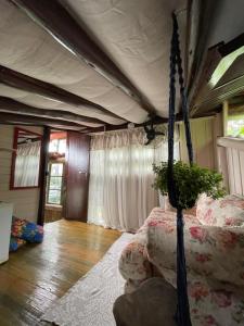 Ένα ή περισσότερα κρεβάτια σε δωμάτιο στο Hostel Antônio Pescador - Centro da Guarda do Embaú