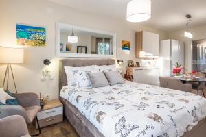 Posteľ alebo postele v izbe v ubytovaní Apartments Stella Mariela