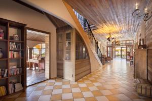 a hallway of a house with a wooden door at Los Establos Boutique Resort - All Inclusive in Boquete