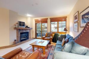 a living room with a couch and a fireplace at Westridge 11 in Ketchum