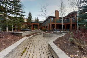 a large house with a brick walkway in front of it at Westridge 11 in Ketchum