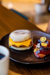 a breakfast sandwich on a plate on a table at Omni San Diego Hotel in San Diego