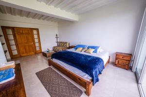 Cama o camas de una habitación en Tambo Eco Hotel