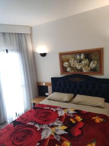Tempat tidur dalam kamar di Bonaparte: flat com suíte, vista incrível e WI-FI