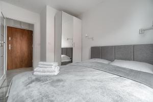 Ένα ή περισσότερα κρεβάτια σε δωμάτιο στο Apartament 777 Stare Miasto Apartamenty No 1