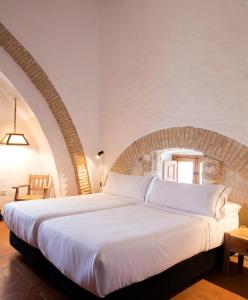Postel nebo postele na pokoji v ubytování Hotel Tugasa Convento San Francisco