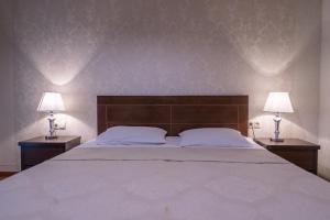 Postel nebo postele na pokoji v ubytování Hotel David Zhorzholiani