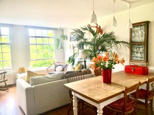 a living room with a couch and a table at Homeawayhome C&R 1 in Amsterdam