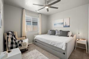 a bedroom with a bed and a ceiling fan at Spacious Cool Springs! Central Nampa 3 Bed in Nampa