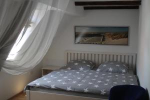 Postel nebo postele na pokoji v ubytování Ferienwohnung Romantica 1. und 2. OG
