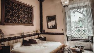 Postel nebo postele na pokoji v ubytování Hacienda Sepulveda Hotel & Spa
