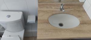 a bathroom with a sink and a toilet at Vista Mar Loft Apartment Downtown Valparaíso in Valparaíso +36 photos