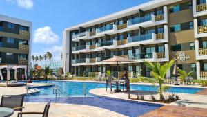 una foto di un hotel con piscina di MANA BEACH EXPERIENCE by AFT Porto de Galinhas, Muro Alto a Porto De Galinhas