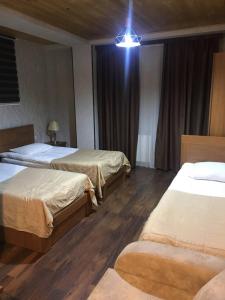 Postel nebo postele na pokoji v ubytování Hotel David Zhorzholiani