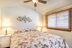 a bedroom with a bed and a ceiling fan at Cozy Arroyo Grande Cottage with Patio and Grill! in Arroyo Grande