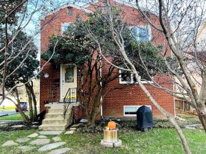 a brick house with a pumpkin in front of it at NEW 3 BRD Modern Urban Gateway in Arlington