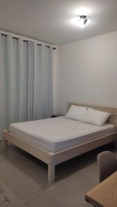 Łóżko lub łóżka w pokoju w obiekcie Céu da Canastra