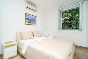Postel nebo postele na pokoji v ubytování SPACIOUS TWO BEDROOM APARTMENT