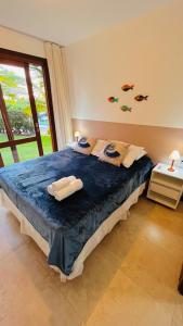 En eller flere senge i et værelse på Casa Peixinho - Reserva Imbassaí 3 suítes