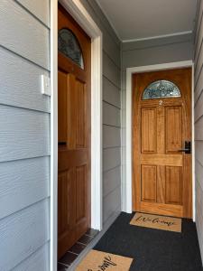 a door with a welcome mat in front of a house at Comfortable 1 bedroom duplex close to everything in Budgewoi