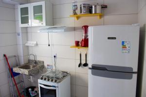 Η κουζίνα ή μικρή κουζίνα στο Perto do Mar, 5G, Ar e Piscina C/Churrasqueira +19 φωτογραφίες