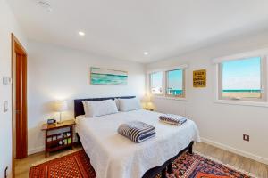 a bedroom with a bed with two pillows on it at Mariners Court - 4 Laurel St Unit 219 in Rehoboth Beach