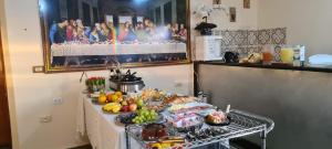 a table with a buffet of food on it at Pousada Romeiros do Pai Eterno - Santuario Basilica de Trindade Goias in Trindade