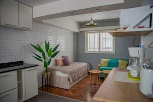 a kitchen and living room with a couch and a table at DEPA DE MAGDA in San Juan