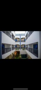 an overhead view of a large white apartment building at RESIDENCE KARMA in Ouagadougou