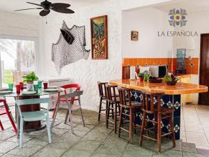 a kitchen with a table and chairs in a room at Casa Española in Puerta de Hierro