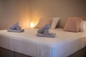 Voodi või voodid majutusasutuse JT Curacao Apartments toas